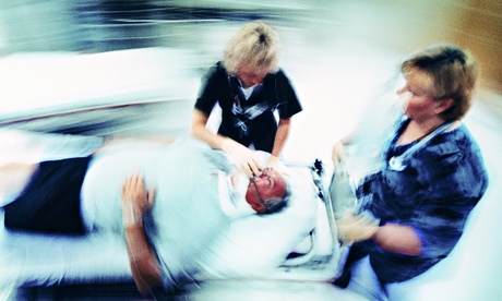 Hospital trauma staff with patient