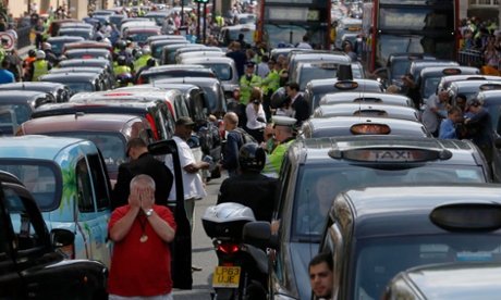 Black-cab drivers blocking a road in protest