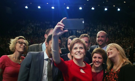 Nicola Sturgeon poses for a mobile phone photograph after delivering her speech at the Scottish National Party conference in Aberdeen