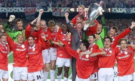 Manchester United manager Alex Ferguson and his team lifting the Uefa Champions League trophy