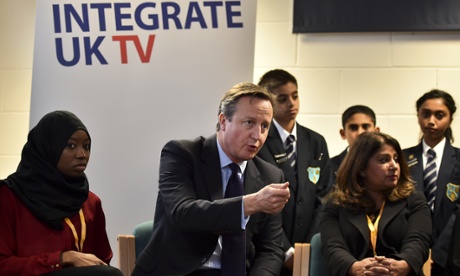 David Cameron speaks with schoolchildren on the day his government has announced its strategy to 