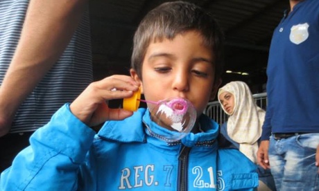 A child blows bubbles