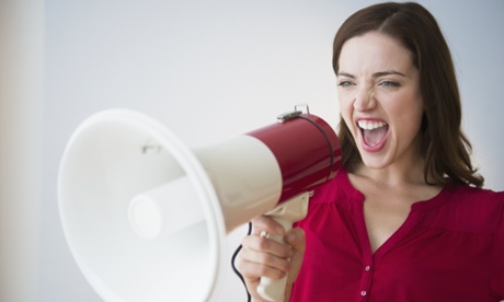 Woman yelling through megaphone