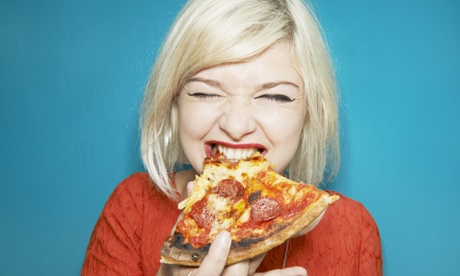 woman eating pizza