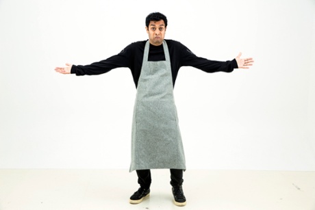 Priya models the Cos wool-mix apron.