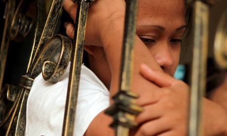 A Filipino maid in a shelter, after fleeing her employer’s home