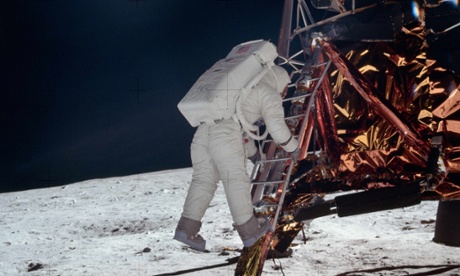 Buzz Aldrin descending the steps of the lunar module as he prepares to walk on the moon on 20 July 1969.