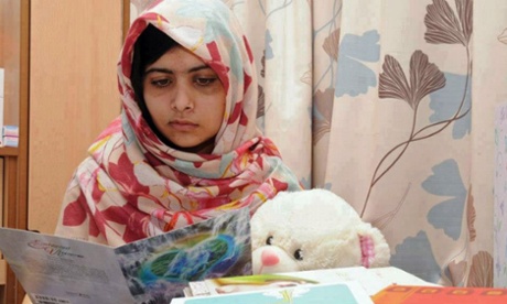 Malala Yousafzai reading get well cards at the Queen Elizabeth II hospital in Birmingham, 2012.