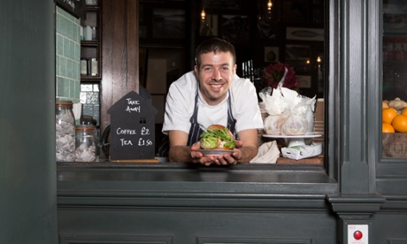 Chef Peter Weeden serving a burger at the hatch at Newman Street Tavern in Soho.