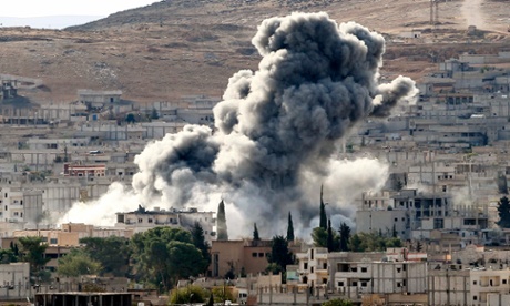   Heavy smoke rises following an airstrike by the US-led coalition aircraft in Kobani, Syria