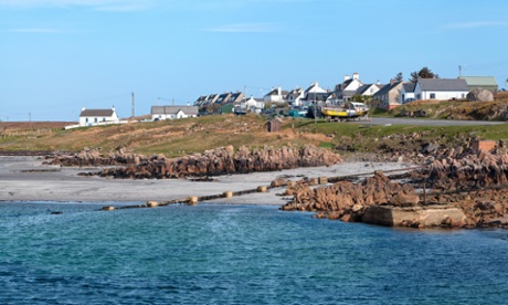 Picture of the Isle of Mull – sea in foreground and town in the background.