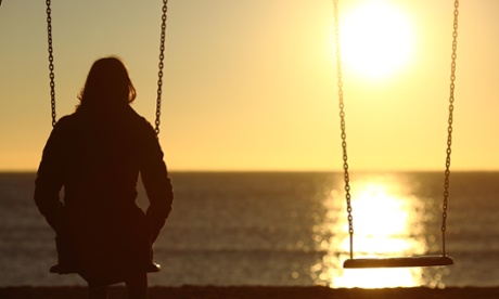 Woman watching sunset alone 