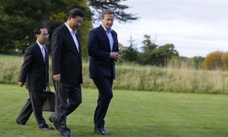 David Cameron and Xi Jinping take a turn round the gardens at Chequers