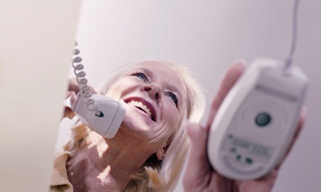 woman smiling holding telephone
