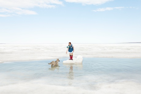 Arctic light: a girl playing with her dog in Tiksi, 2012.