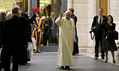 Pope Francis waves as he leaves at the end of the Synod of bishops at the Vatican.