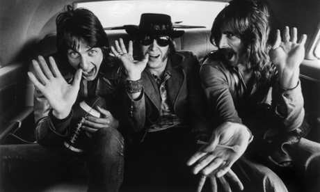 Cory Wells, left, with the other members of Three Dog Night, Joe Schermie  and Chuck Negron in the backseat of a car