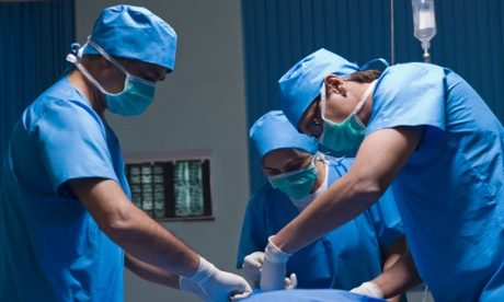 Doctors in operating theatre