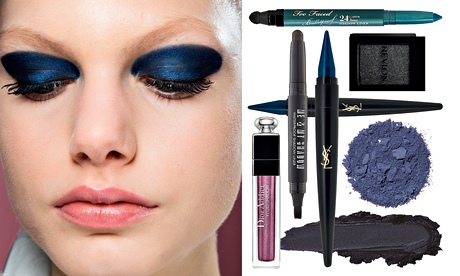 model wearing very dark eyeshadow, plus selection of products