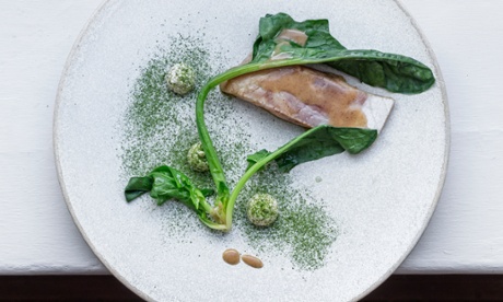 Sea bass and spinach on a plate