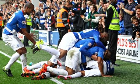 QPR's Jay Emmanuel-Thomas is mobbed by team-mates after scoring the winner during against Bolton.