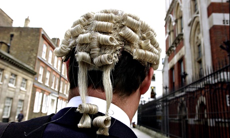 Barrister wearing a wig and gown