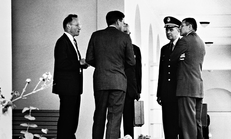 Kennedy talking with his officials during the Cuban missle crisis.
