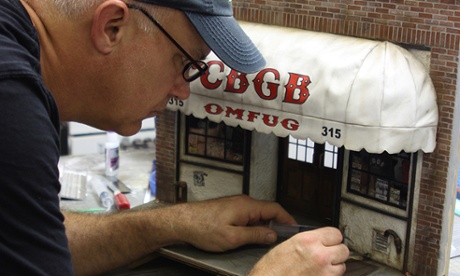 Artist Randy Hage works on a miniature of legendary punk club CBGB.