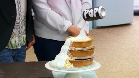 A floating soda can over layered cheesecakes