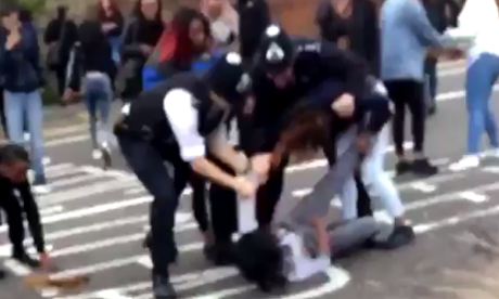police officers trying to restrain a person in Walthamstow