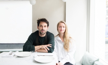 Nemanja Borjanovic and Melody Adams sitting side by side at a set table