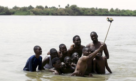 A group of young men take a picture of themselves in the River Nile outside Khartoum, Sudan.