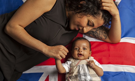 Eama Hussein with her baby lying on a Union Jack