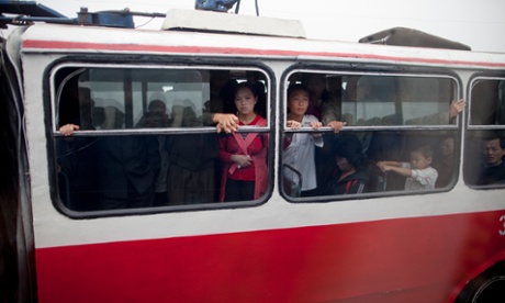 Passengers on a bus in Pyongyang shot during an organised media tour of the city.