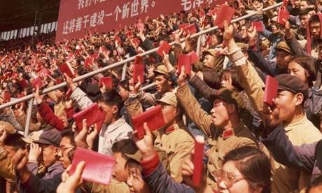 Soldiers and civilians brandish Mao's little red book at a rally in Beijing in April 1967.