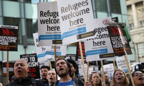 Refugees welcome – or keep out (illegal) ‘migrants’? Protesters outside the Conservative party conference as the home secretary was speaking this week.