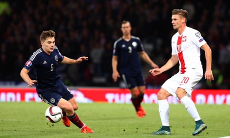 James Forrest of Scotland and Lukasz Piszczek of Poland, last night, doing things.