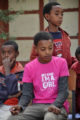 Boys discuss child marriage during children's parliament session at school 