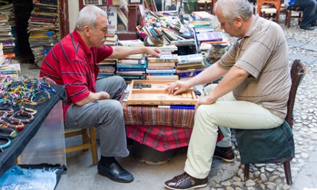 Men playing backgammon in Hazzopulo Passage off Istiklal Cadessi, Beyoglu, Istanbul, Turkey