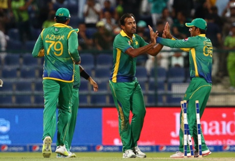 Riaz celebrates with his teammate after dismissing Buttler.