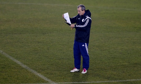 Bosnia-Herzegovina coach Mehmed Bazdarevic takes time out from training to read his print-out of a daily football email. You can tell from his lack of mirth.