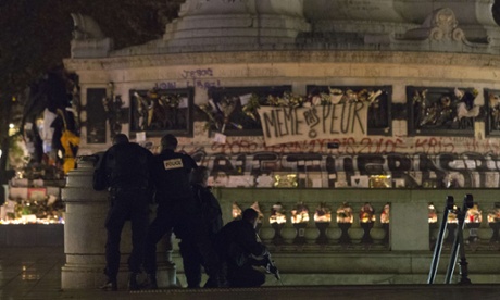 Armed police move in to secure the area as panic spreads at Place de la Republique.