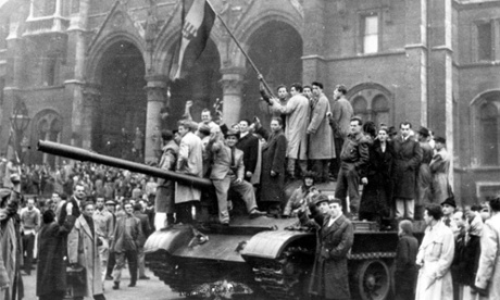 Hungarian rebels wave their national flag from a tank captured in the main square of Budapest, Hungary, in this 1956 file photo. The uprising began with demonstrations against the Stalinist regime in Budapest and was crushed eleven days later by Soviet tanks amid bitter fighting. Some 2,500 people were killed and a further 200,000 forced into exile.