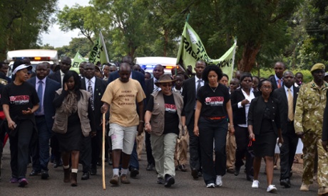 The First Lady of Kenya, Her Excellency Margaret Kenyatta (centre with hat) in her role as Patron of the campaign “Hands Off Our Elephants”, launched in 2013. The marchers are accompanying Jim Nyamu (in the beige t-shirt) on part of his walk across Kenya t raise awareness about poaching.