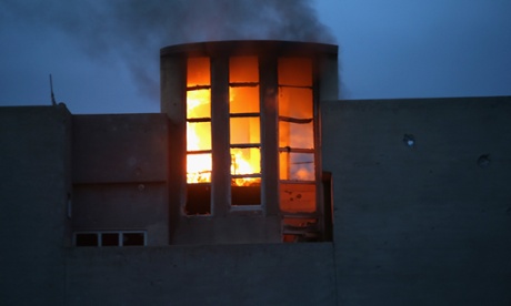 A house burns  in Sinjar, Iraq. Kurdish forces, with the aid of months of U.S.- led coalition airstrikes, liberated the town from ISIS extremists. Although many minority Yazidis celebrated the victory, their home city of Sinjar lay in complete ruins.