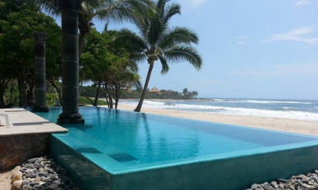 The outdoor swimming pool at Hacienda Eden, Playa Troncones, Guerrero, Mexico – and a view towards the beach and sea.
