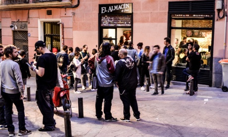 Pedestrians and visitors outside El Almacén de Discos, Madrid.