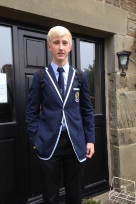 Andrew Davies in his school uniform at home