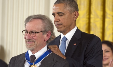 Steven Spielberg receives the Presidential Medal of Freedom from Barack Obama on 24 November 2015.