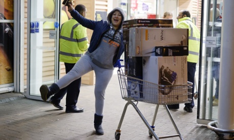 Figen Akgul celebrates her Black Friday sale purchases at Tesco Lea Valley in North London